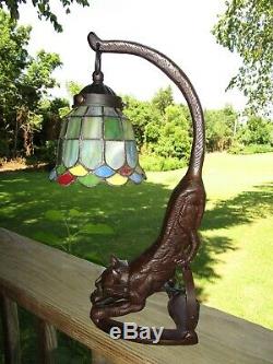 Vtg. Bronze metal Pouncing Cat Lamp GREEN LIGHT UP EYES With Stained glass Shade